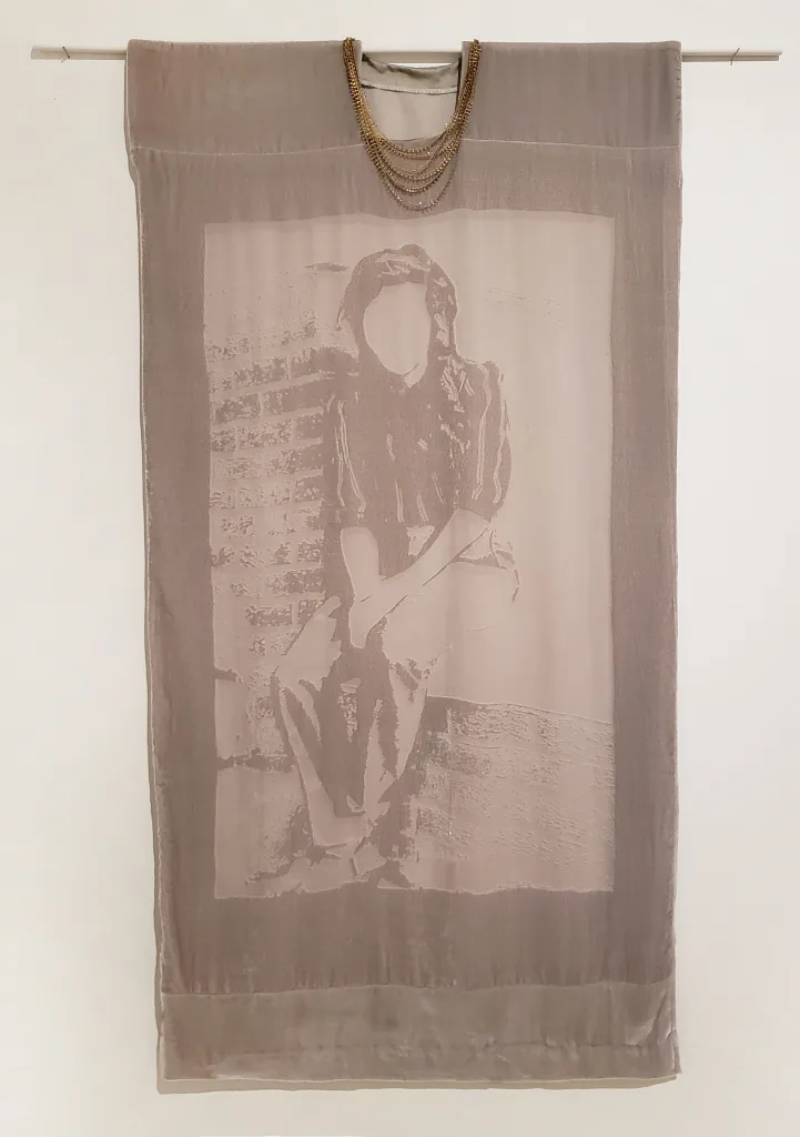 A lady is sitting on the porch