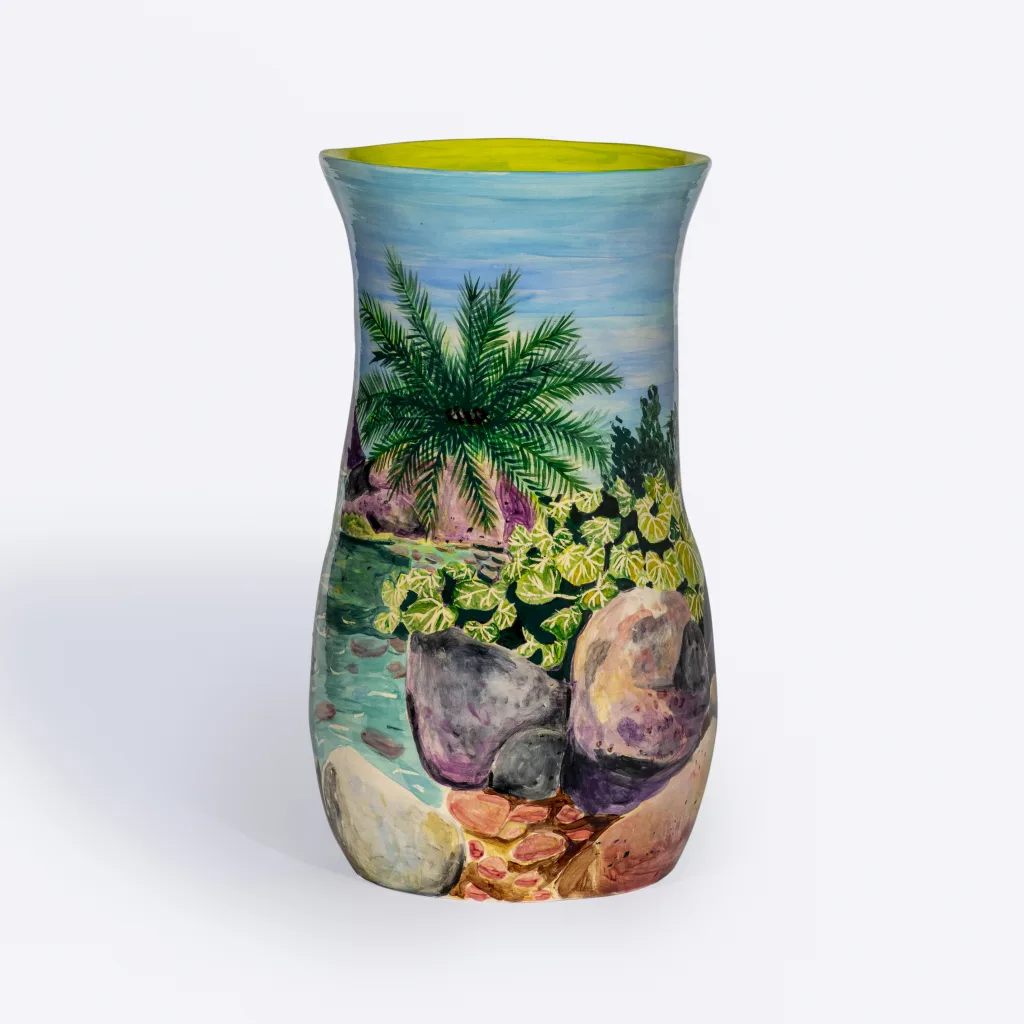 A pond landscape is painted on a ceramic