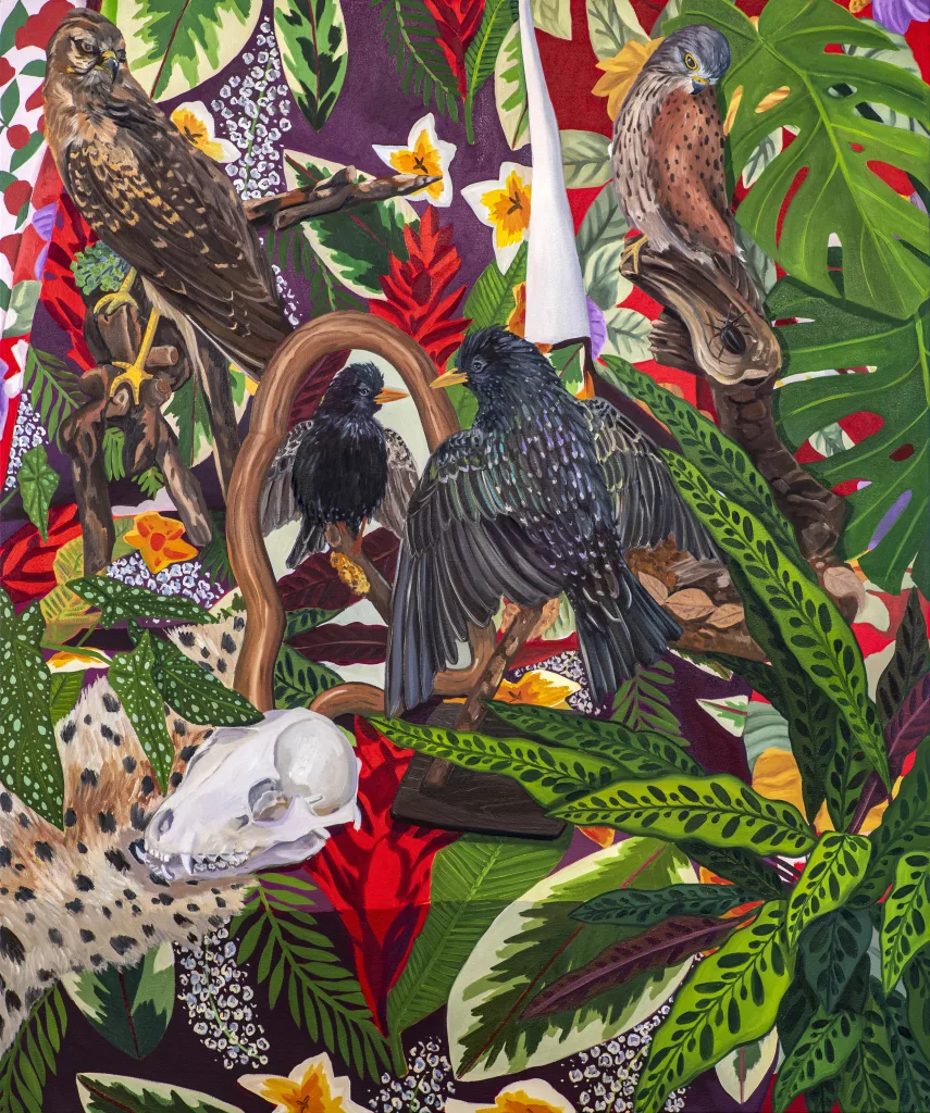 A painting shows three taxidermized birds and some animal bones. There are striped leaves and flowers surrounding the canvas