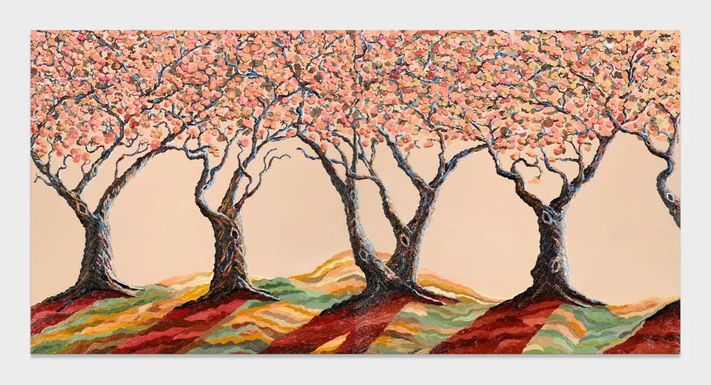A row of trees with pink leaves lined up beside each other sitting atop red, orange, and green hills.