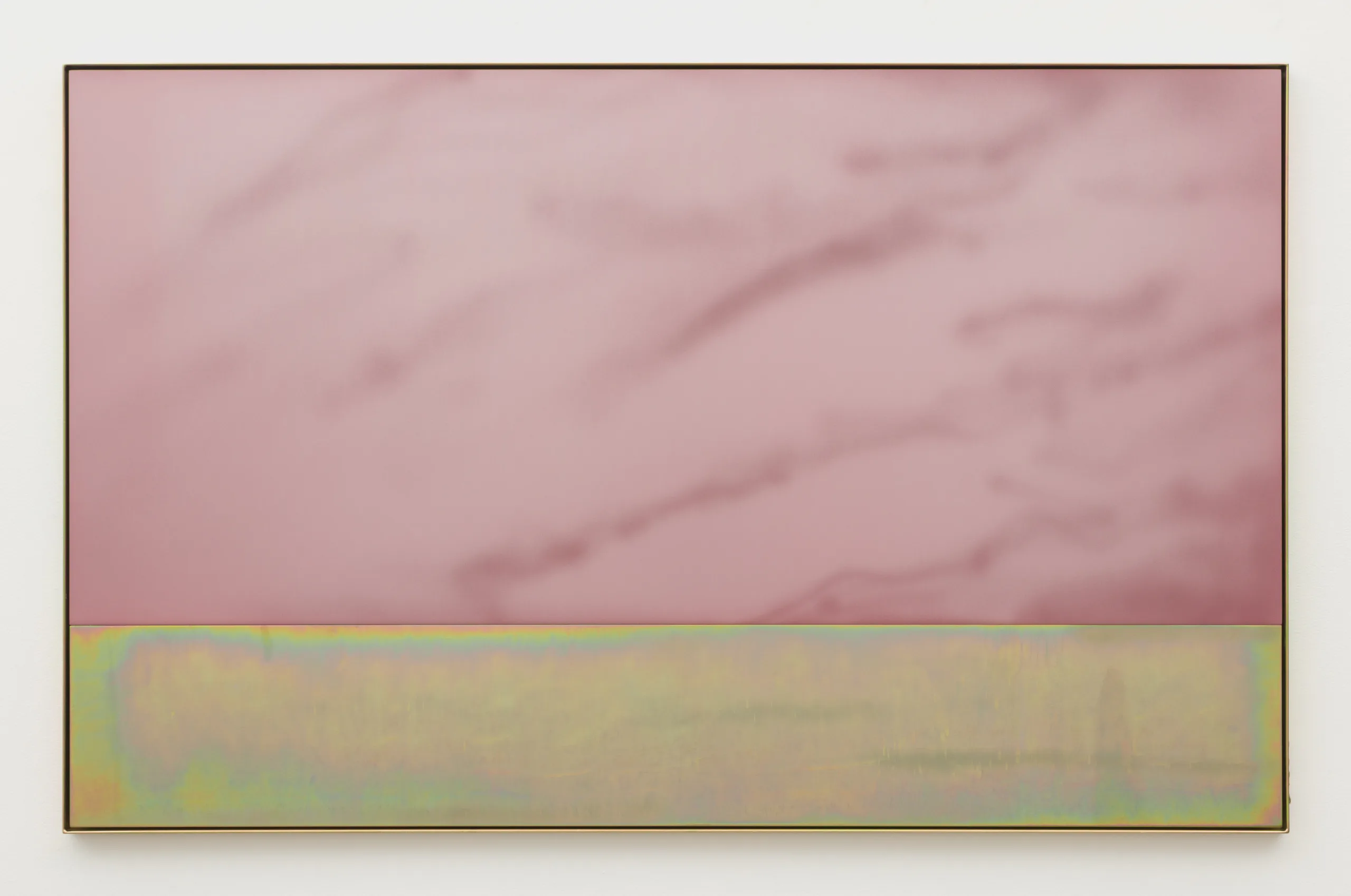 A light pink plate of anodized aluminum with cloud like sandblasted marks sits within a yellow zinc plated steel frame. Nestled within the same frame is a plate of yellow zinc plated steel with slight horizontal sandblasting.
