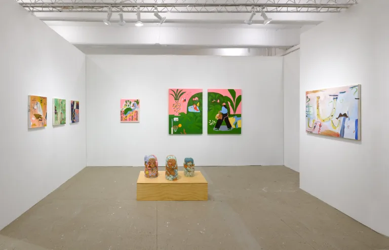 OCHI's booth at NADA New York 2024 featuring paintings by Lilian Martinez and b chehayeb and ceramic sculptures by Kristy Moreno