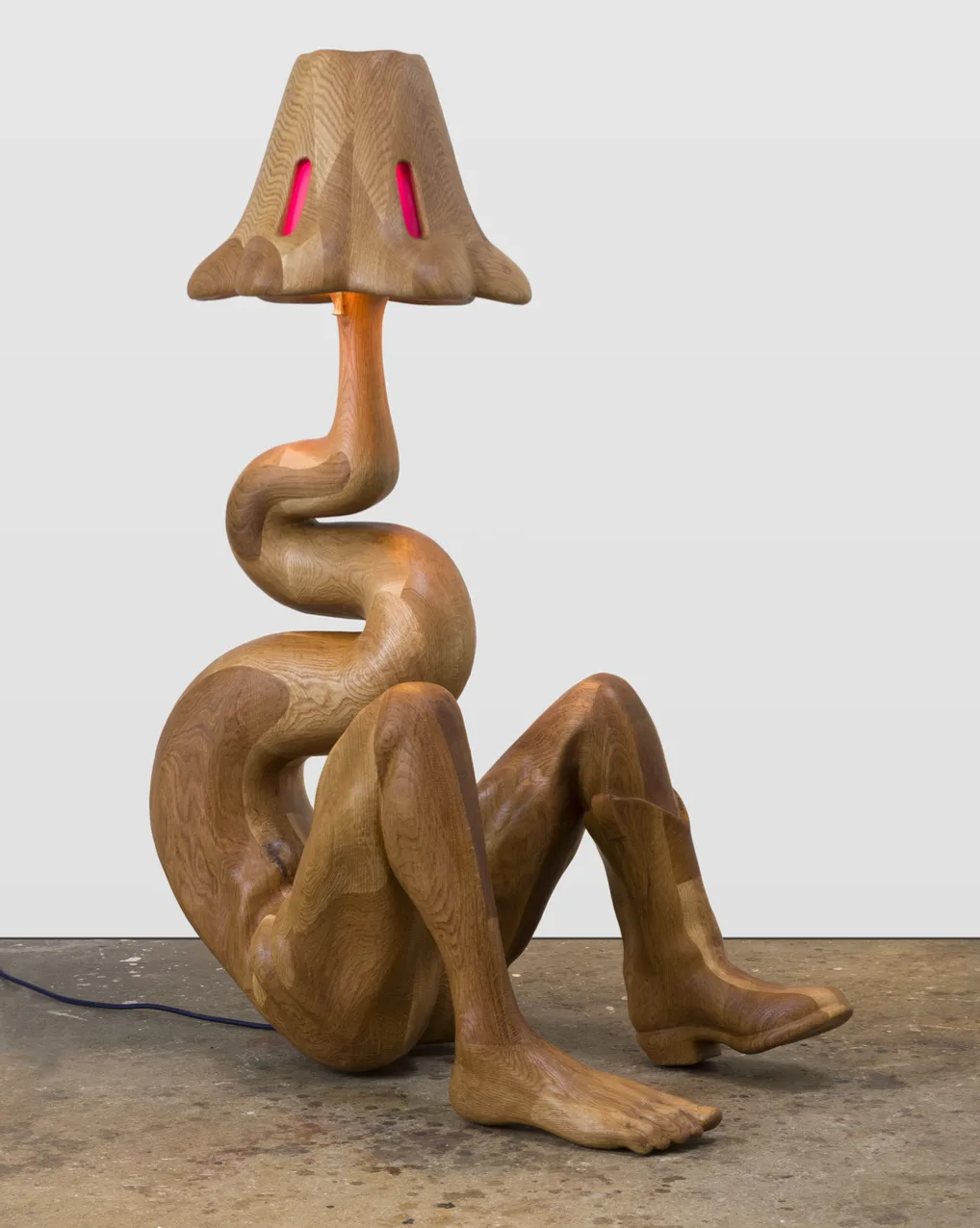 A wooden anthropomorphic lamp