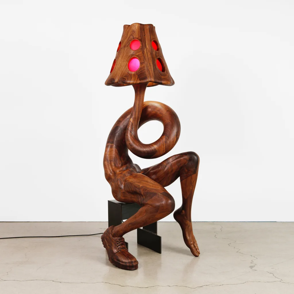 A wooden anthropomorphic lamp